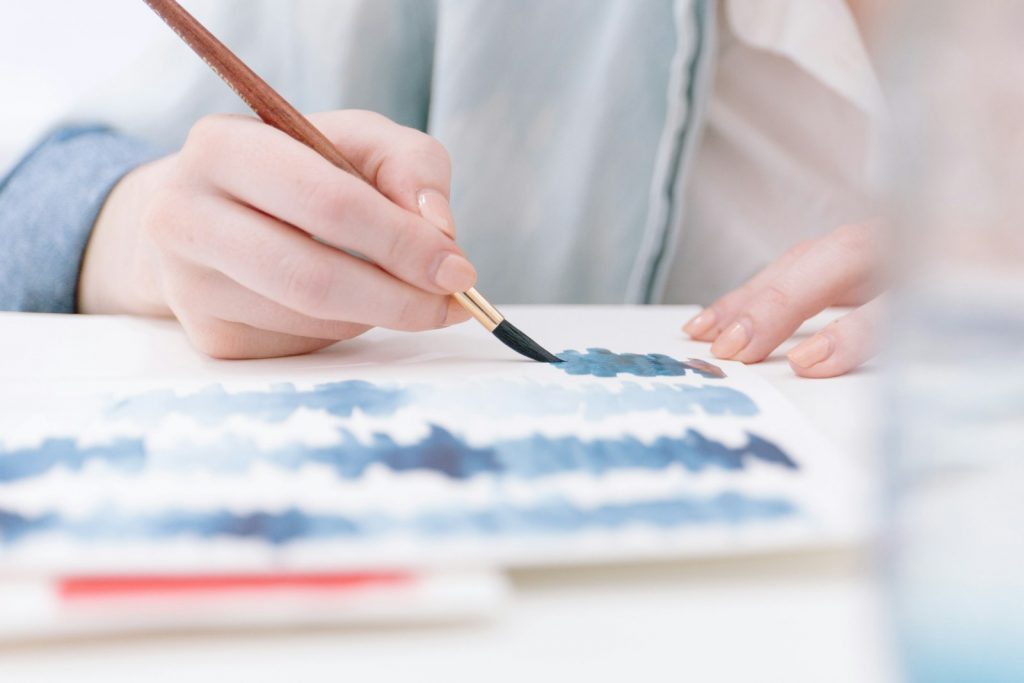 person holding paint brush